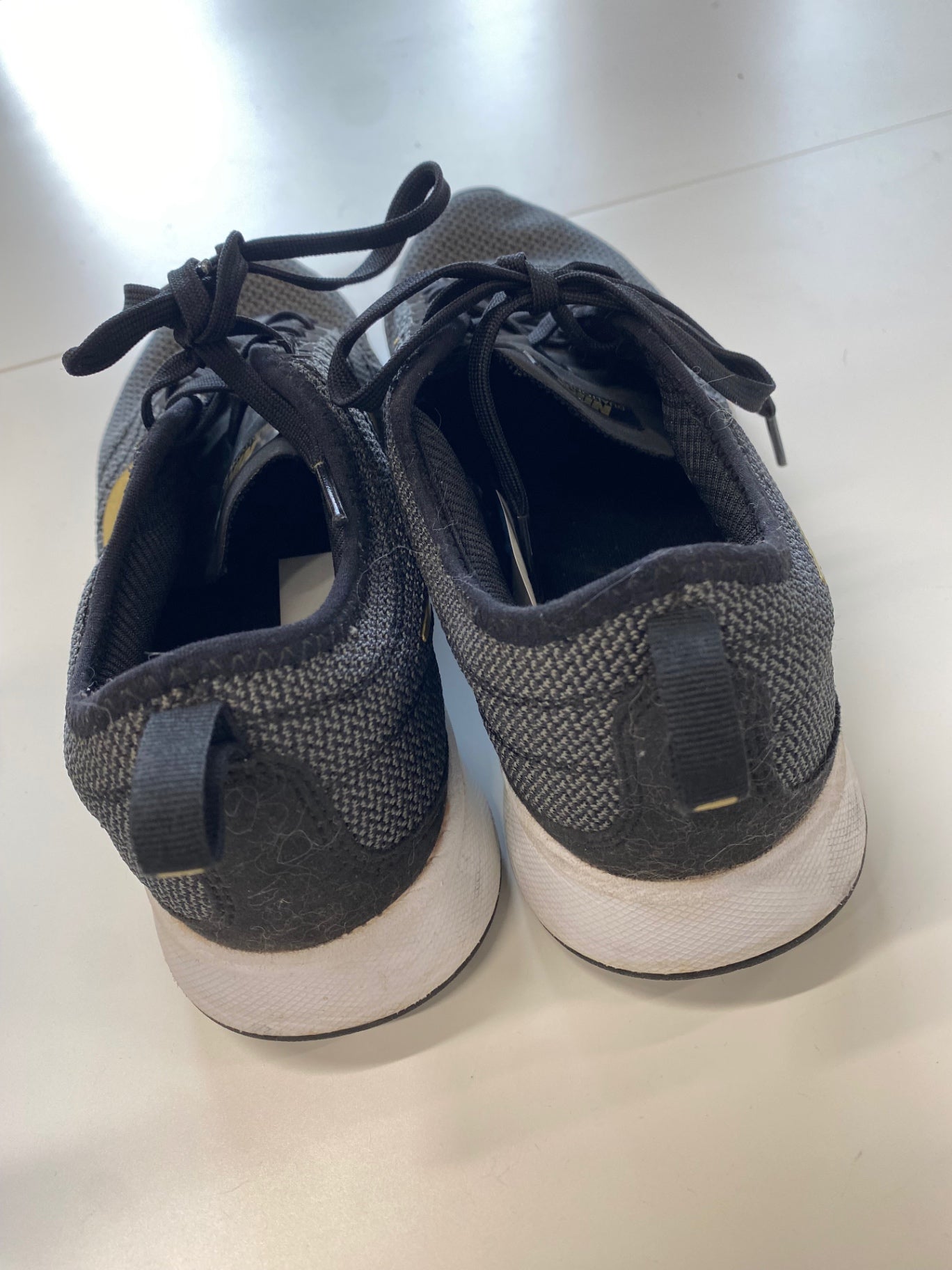 Fabulous Nike dual tone racer Sneakers UK 5 Black and Gold